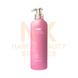 Pink bottle with pump dispenser on a white background, featuring 'NX Hair & Beauty Supplies' text.